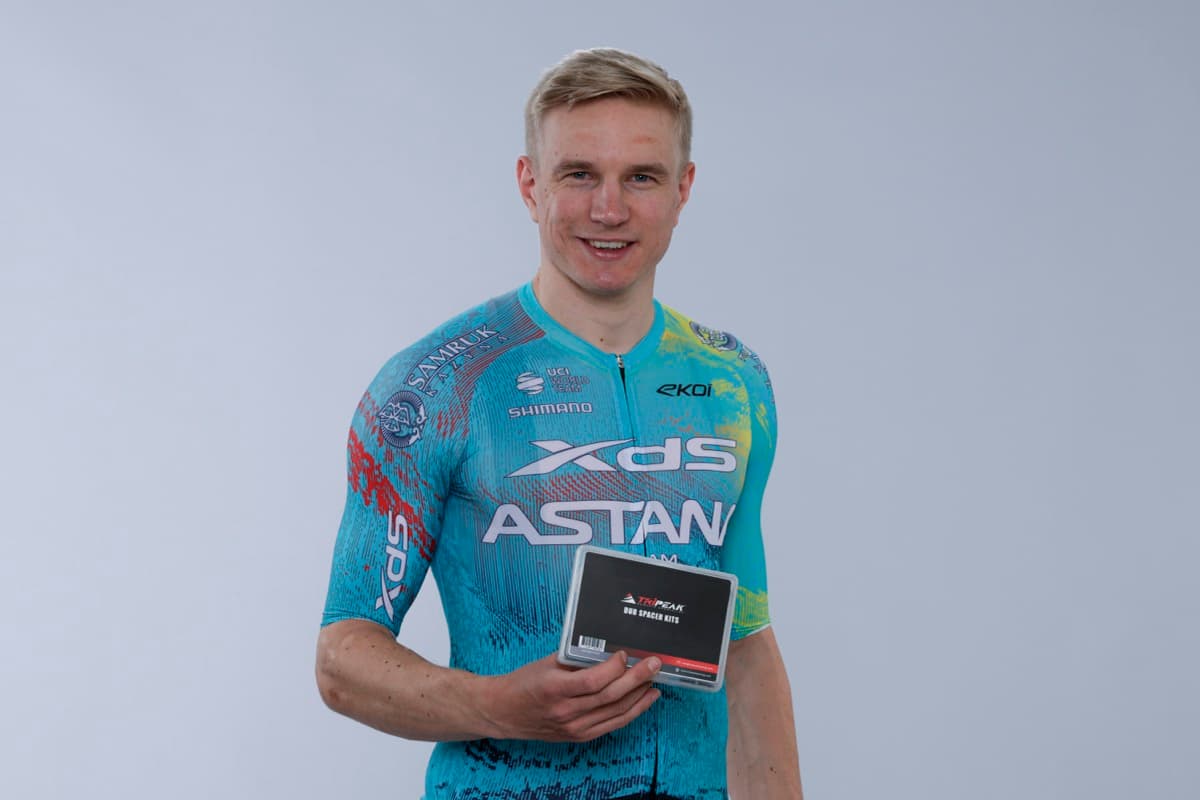 An XDS Astana rider holding a TRiPEAK DUB spacer kit